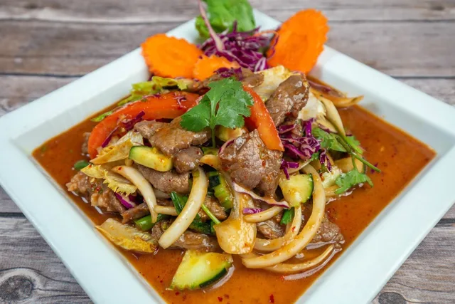 Plated Thai dish with meat and vegetables at Jitlada.