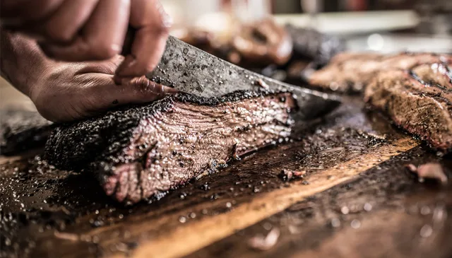 Brisket being sliced at Pecan Lodge.